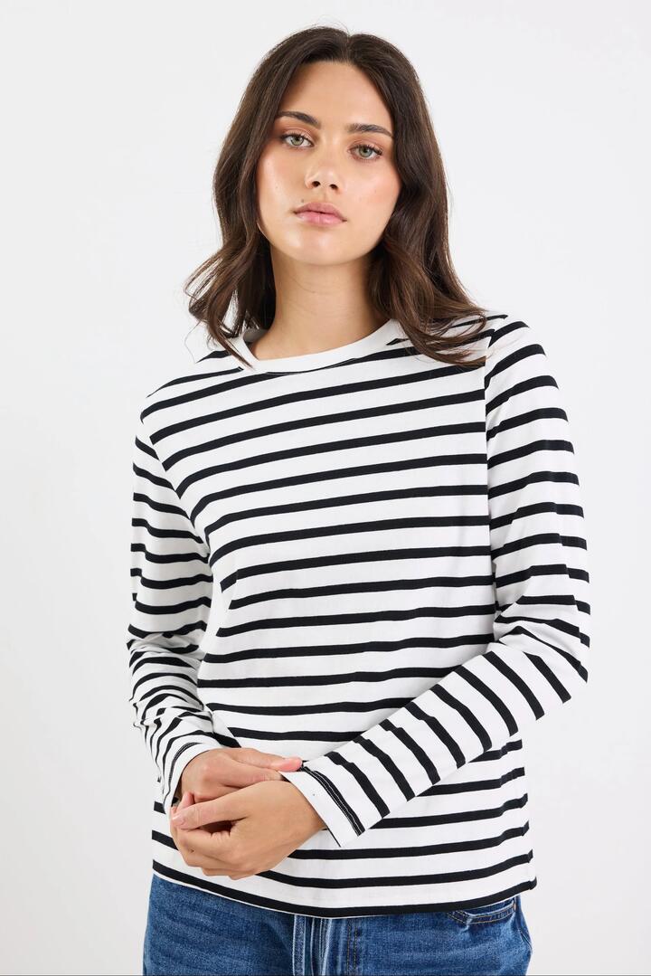 Image of a model wearing Tops. Product name - Tether Black White Stripe LS Boxy Tee in Black White Stripe colour by brand - RE:UNION Label