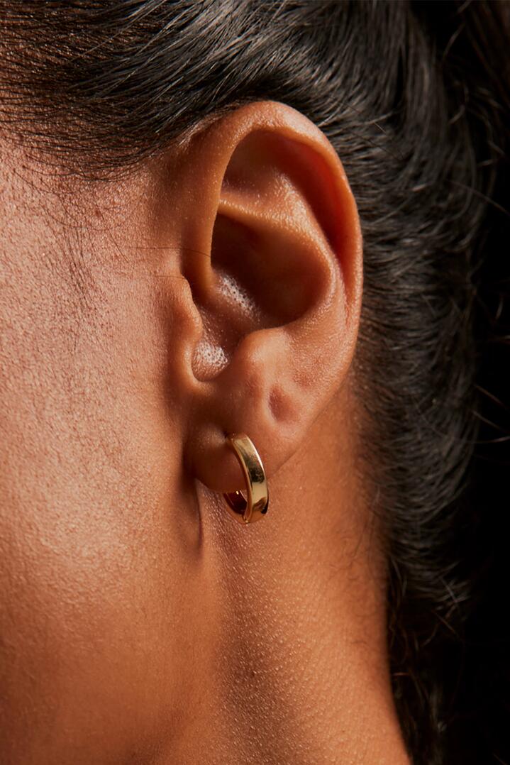 Image of Jewelry. Product name - Simple Huggie Gold Earrings in Gold colour by brand - Humble + Heart