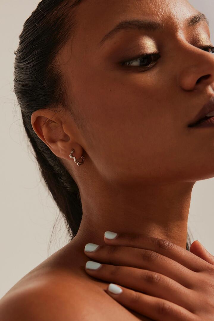 Image of Jewelry. Product name - Wavey Hoop Rhodium Earrings in colour by brand - Humble + Heart