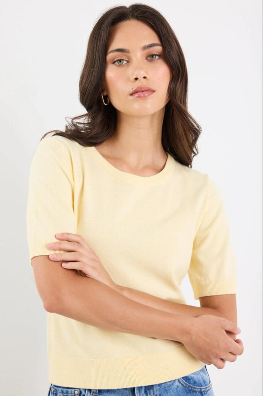 Image of a model wearing Outerwear. Product name - Edition Lemon Crewneck Cashmere Blend Knit Tee in Lemon colour by brand - Stories be Told