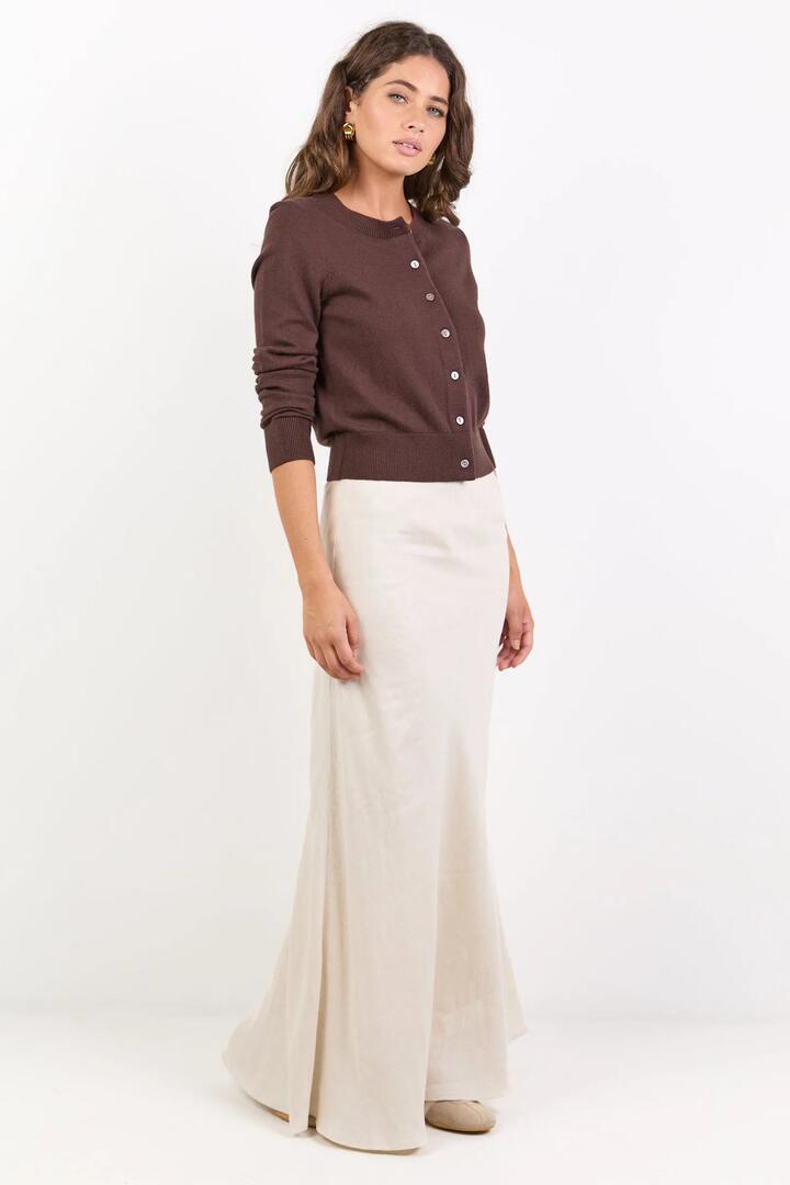 Image of a model wearing Skirts. Product name - Lagos Natural Linen Blend Bias Maxi Skirt in Natural colour by brand - RE:UNION Label