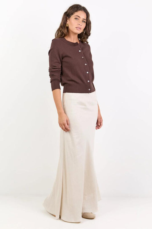 Image of a model wearing Skirts. Product name - Lagos Natural Linen Blend Bias Maxi Skirt in Natural colour by brand - RE:UNION Label