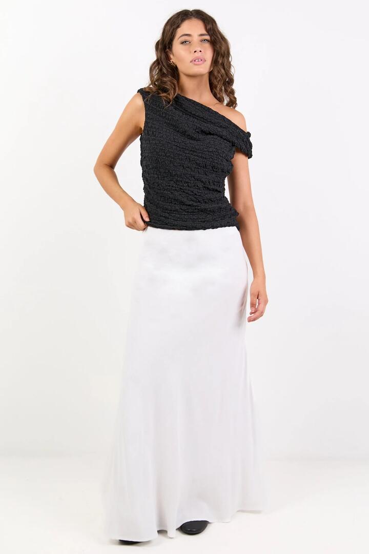 Image of a model wearing Skirts. Product name - Lagos White Linen Blend Bias Maxi Skirt in White colour by brand - RE:UNION Label
