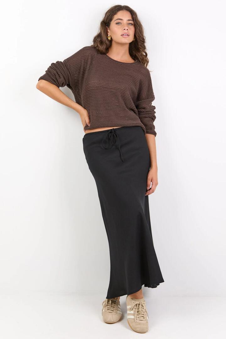 Image of a model wearing Skirts. Product name - Summit Black Linen Blend Tie Waist Bias Maxi Skirt in Black colour by brand - Among the Brave