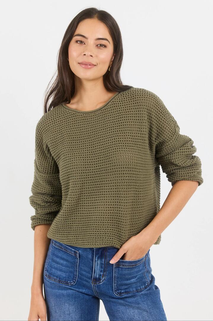 Image of a model wearing Outerwear. Product name - Dawn Soft Khaki Crochet Knit Jumper in Soft Khaki colour by brand - RE:UNION Label