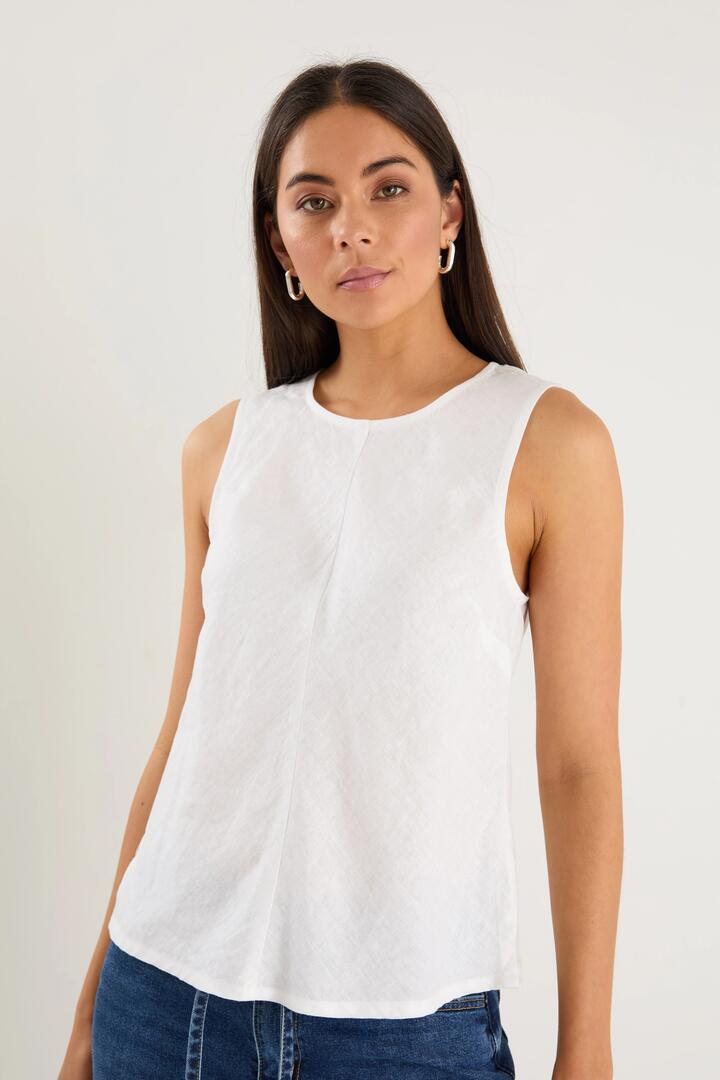 Image of a model wearing Tops. Product name - Shoreline Ivory Linen Bias Sleeveless Shell Top in Ivory colour by brand - RE:UNION Label