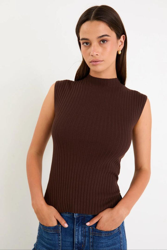 Image of a model wearing Outerwear. Product name - Heroic Chocolate Sleeveless Funnel Neck Rib Knit Top in Chocolate colour by brand - Among the Brave