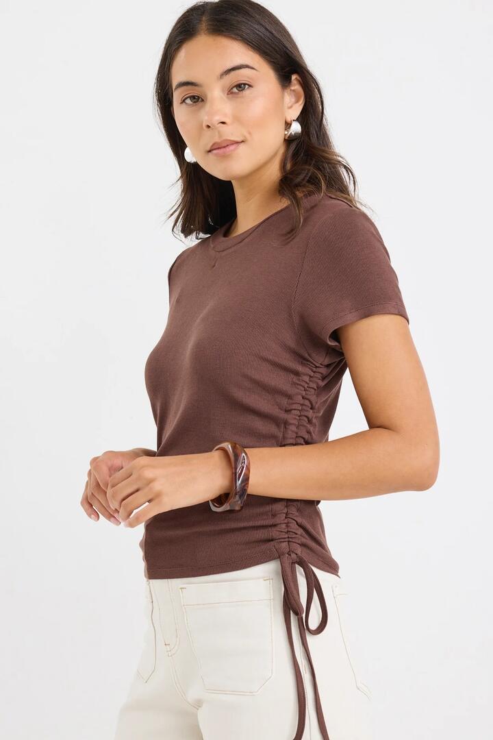 Image of a model wearing Tops. Product name - Perfect Chocolate Rib Rouched Side Crop Tee in Chocolate colour by brand - Among the Brave
