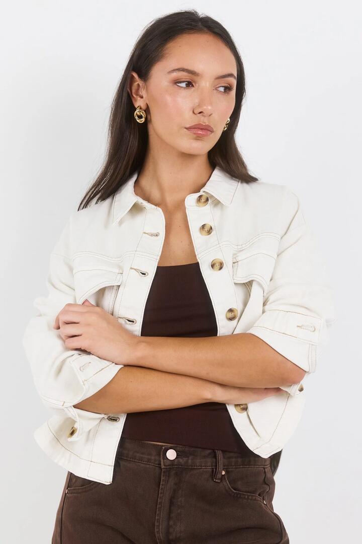 Image of Coats & Jackets. Product name - Echo Ecru Patch Pocket Denim Jacket in Ecru colour by brand - Among the Brave