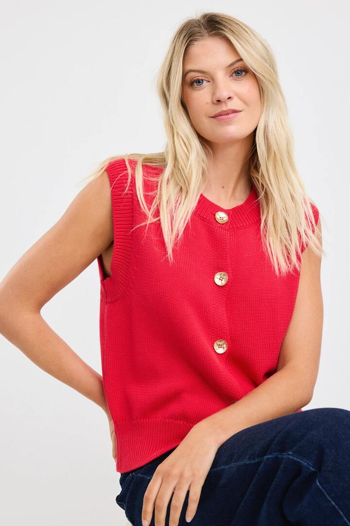 Image of a model wearing Outerwear. Product name - Trait Cherry Soft Mid Weight Crewneck Knitted Vest Top in Cherry colour by brand - Stories be Told
