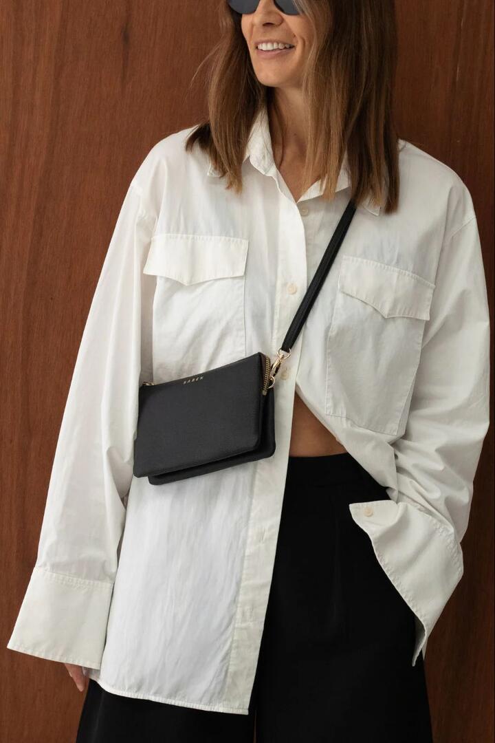 Image of Bags. Product name - Tilly Multi Pocket Black Leather Crossbody Clutch in Black colour by brand - Saben