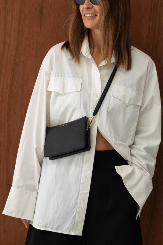 Image of Bags. Product name - Tilly Multi Pocket Black Leather Crossbody Clutch in Black colour by brand - Saben
