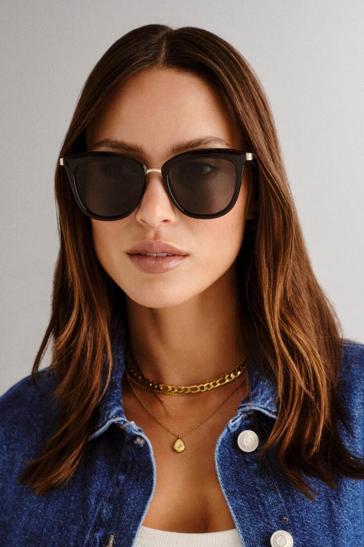 Image of Sunglasses. Product name - Caliente Black Gold Arms Khaki Lens Sunglasses in Black colour by brand - Le Specs