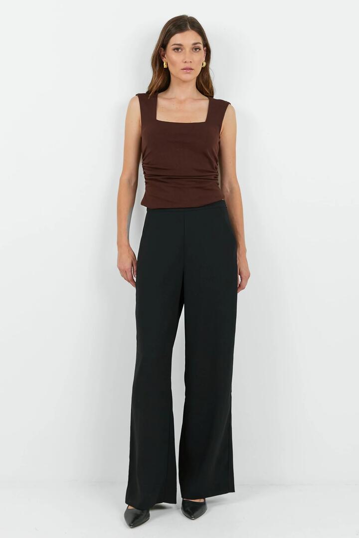 Image of a model wearing Pants. Product name - Best Life Black Soft Crepe Wide Leg Pant in Black, Black Soft Crepe colour by brand - Among the Brave