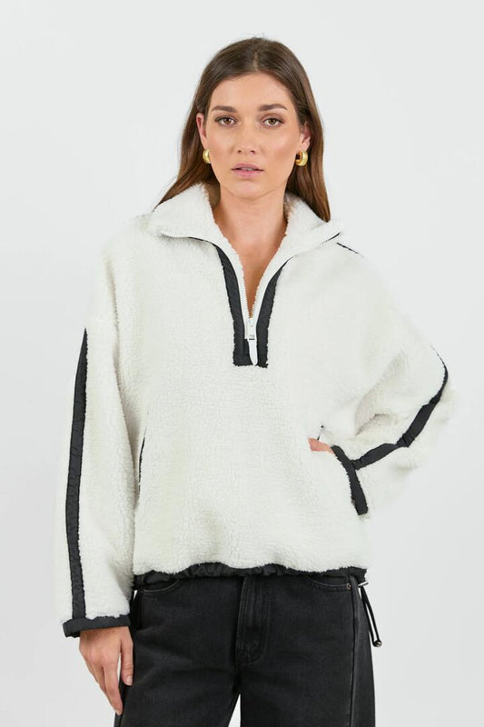 Image of a model wearing Outerwear. Product name - Untold Cream Contrast Detail Quarter Zip Sherpa Sweatshirt in Cream colour by brand - Stories be Told