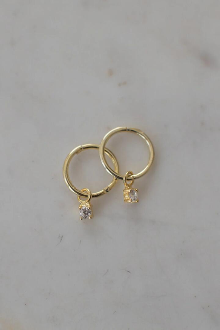 Image of Jewelry. Product name - Mini Rock Sleeper Earrings Clear Gold in Gold colour by brand - Sophie
