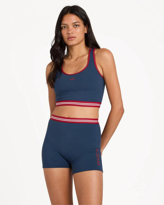 Image of a model wearing Shorts. Product name - Rvca Womens Va Essential 4" Sport Shorts Navy in Navy colour by brand - Rvca