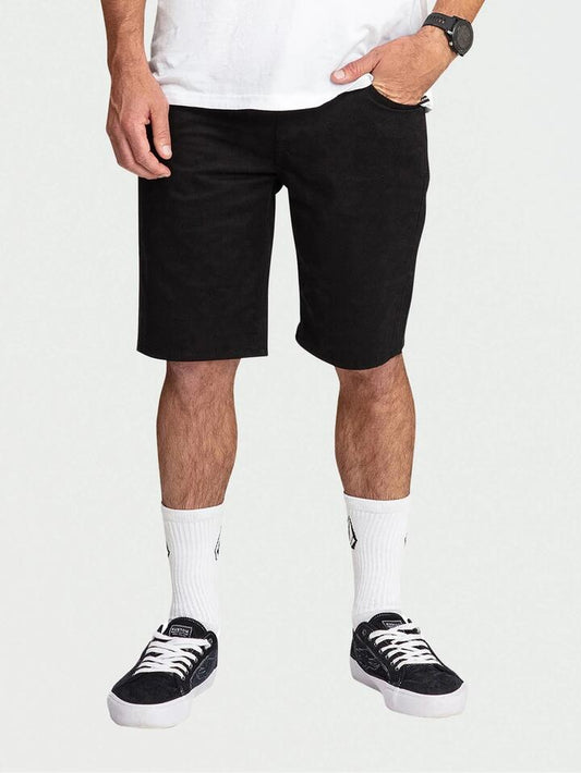 Image of a model wearing Shorts. Product name - Volcom Mens Solver Lite 5 Pocket 19" Walkshorts Black in Black colour by brand - Volcom