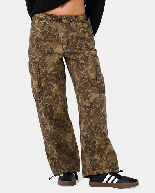 Image of a model wearing Pants. Product name - Rip Curl Womens Paradise Camo Cargo Pants Khaki in Khaki colour by brand - Rip Curl