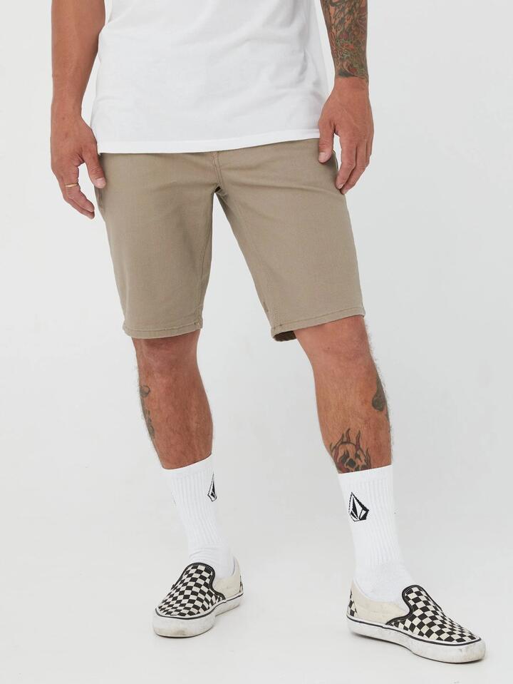 Image of a model wearing Shorts. Product name - Volcom Mens V Vorta Walkshorts Beige in Beige colour by brand - Volcom
