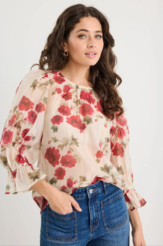 Image of a model wearing Tops. Product name - Candid Cream Red Rose Crew Neck Mid Sleeve Top in Cream Red Rose colour by brand - Ivy + Jack