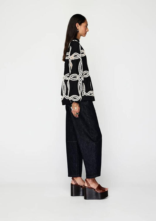 Image of a model wearing Tops. Productname: Livia Top | MOS The Label in Black colour by brand - MOS The Label