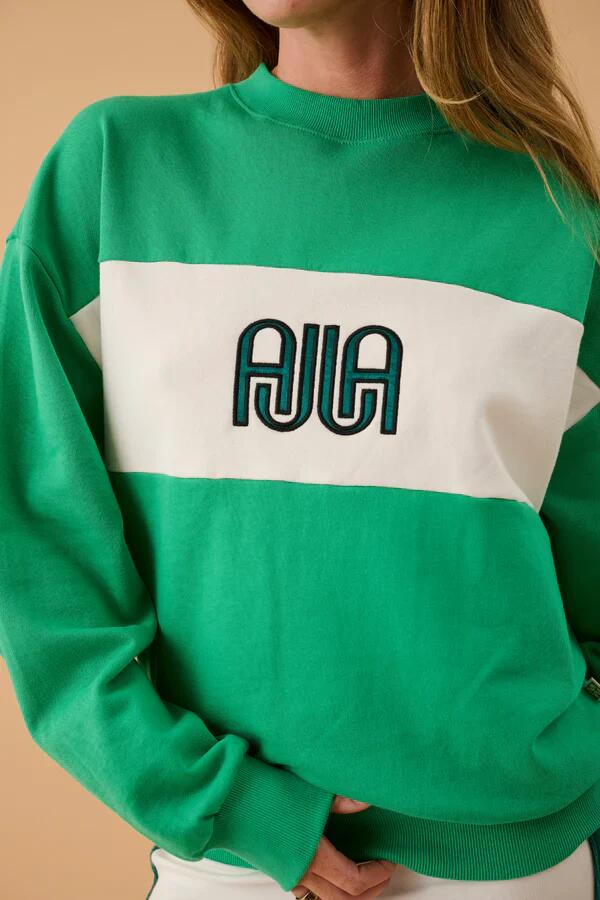 Image of a model wearing Outerwear. Product name - A James Tropical Green Sweatshirt in Green colour by brand - Araminta James