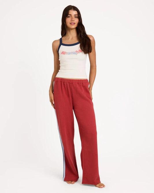 Image of a model wearing Pants. Product name - Billabong Womens Culture Trackpants Red Crush in Red Crush colour by brand - Billabong