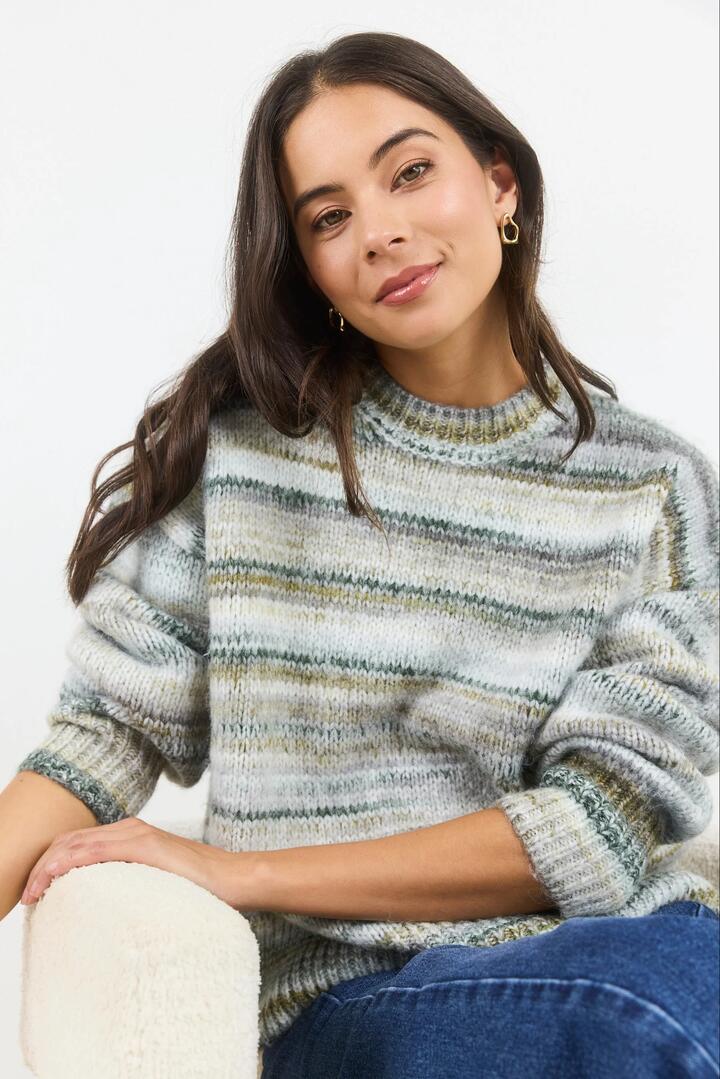 Image of a model wearing Outerwear. Product name - Arbitrary Khaki Multi Space Dye Crewneck Jumper in Khaki Multi colour by brand - Among the Brave