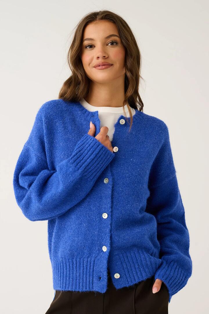 Image of a model wearing Outerwear. Product name - Aurora Cobalt Wool Blend Cardi in Blue colour by brand - Cartel & Willow