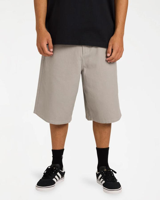Image of a model wearing Shorts. Product name - Billabong Mens Spec Bio Twill Walkshorts Ash in Ash colour by brand - Billabong
