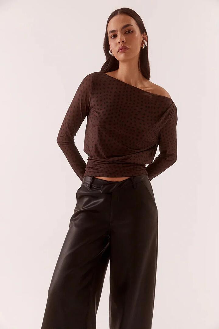 Image of a model wearing Tops. Product name - Zuri Rum Raisin Spot LS Top in Brown colour by brand - Sovere