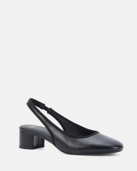 Image of a model wearing Pants. Product name - Intro Black Pumps in Black colour by brand - Novo