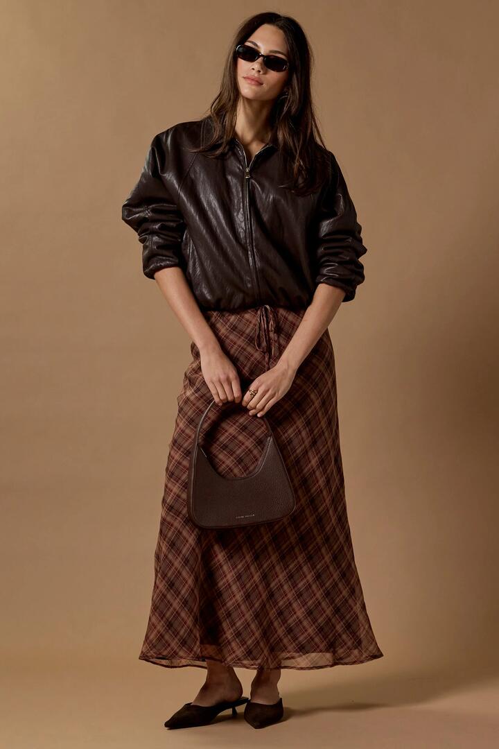 Image of a model wearing Skirts. Product name - Align Wine Cinnamon Check Tie Waist Bias Maxi Skirt in Wine Cinnamon Check colour by brand - Stories be Told
