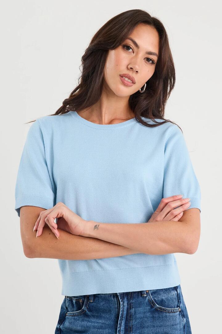 Image of a model wearing Outerwear. Product name - Edition Sky Blue Crewneck Cashmere Blend Knit Tee in Sky Blue colour by brand - Stories be Told