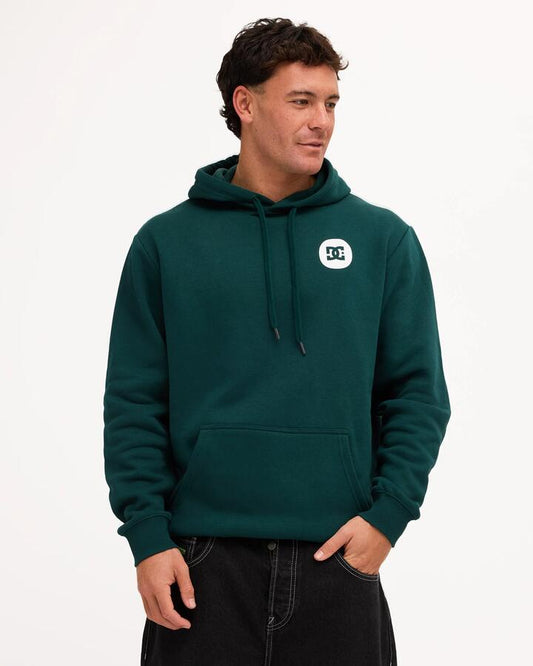 Image of a model wearing Outerwear. Product name - DC Shoes Mens Shaped Destroy Pullover Hoodie Ponderosa Pine in Ponderosa Pine colour by brand - DC Shoes