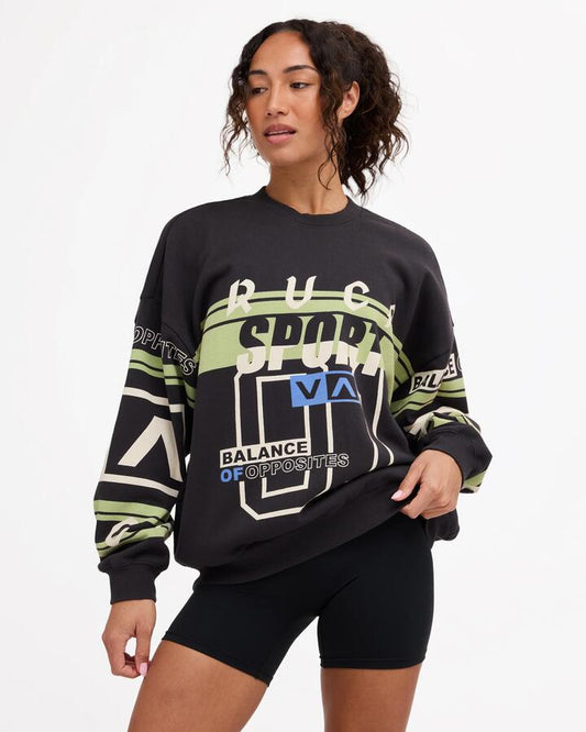 Image of a model wearing Outerwear. Product name - Rvca Womens Sport Pullover Crew Washed Black in Washed Black colour by brand - Rvca
