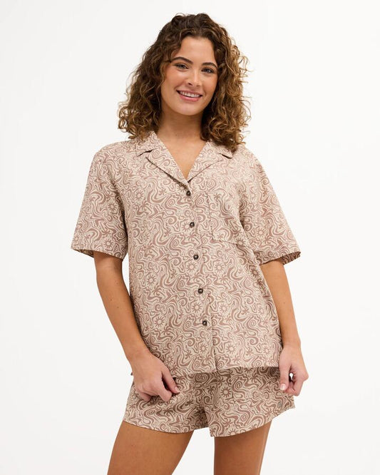 Image of a model wearing Tops. Product name - Quiksilver Womens Serene Short Sleeve Shirt Almond in Almond colour by brand - Quiksilver
