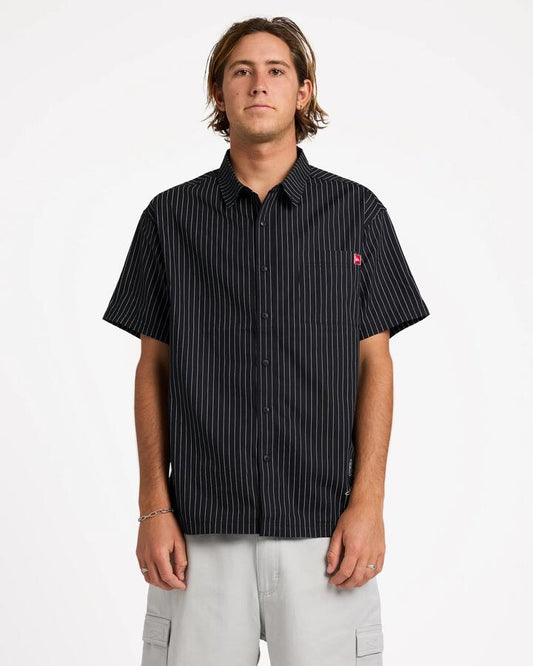 Image of a model wearing Tops. Product name - Quiksilver Mens Altered Short Sleeve Shirt Black in Black colour by brand - Quiksilver