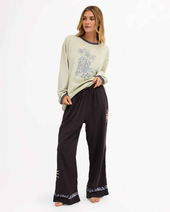 Image of a model wearing Pants. Product name - Billabong Womens Paradise 73 Elastic Waist Pants Black Sands in Black Sands colour by brand - Billabong