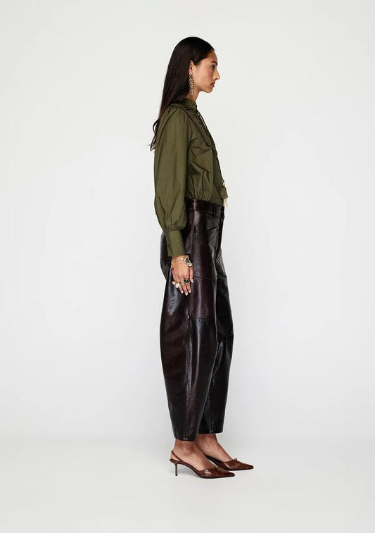 Image of a model wearing Pants. Productname: Anika Leather Pants | MOS The Label in Chocolate colour by brand - MOS The Label