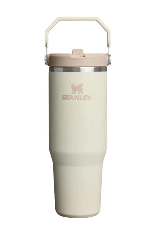 Image of a model wearing Tops. Product name - IceFlow Cream Flip Straw Top Handle 887ml 2.0 Tumbler in Cream colour by brand - Stanley