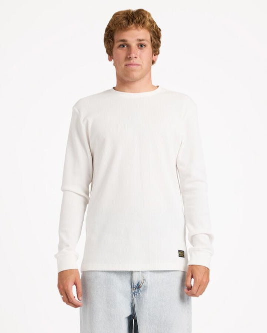 Image of a model wearing Tops. Product name - Rvca Mens Dayshift Thermal Long Sleeve T-Shirt Antique White in Antique White colour by brand - Rvca