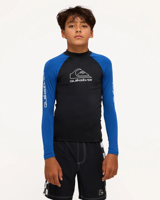 Image of a model wearing Tops. Product name - Quiksilver Boys 8-16 On Tour Long Sleeve Rash Vest Monaco Blue in Monaco Blue colour by brand - Quiksilver