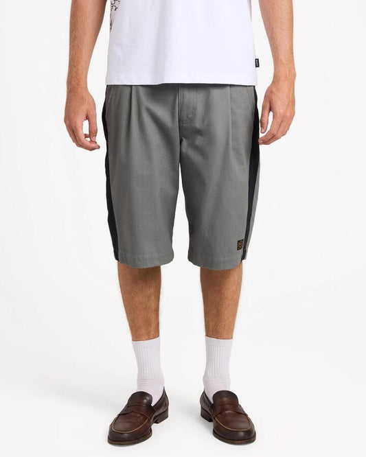 Image of a model wearing Shorts. Product name - Rvca Mens Dayshift Panel 22" Shorts Smoke in Smoke colour by brand - Rvca