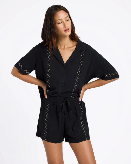 Image of a model wearing Shorts. Product name - Volcom Womens Bloomz Shorts Black in Black colour by brand - Volcom