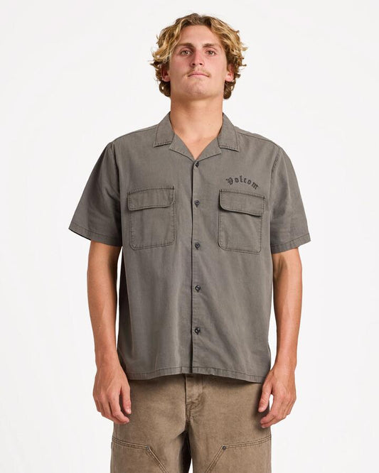 Image of a model wearing Tops. Product name - Volcom Mens Spares Short Sleeve T-Shirt Black in Black colour by brand - Volcom