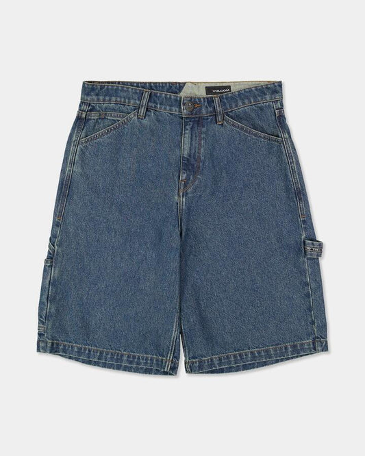 Image of a model wearing Shorts. Product name - Volcom Mens Stonemill Denim Shorts Indigo Ridge Wash in Indigo Ridge Wash colour by brand - Volcom