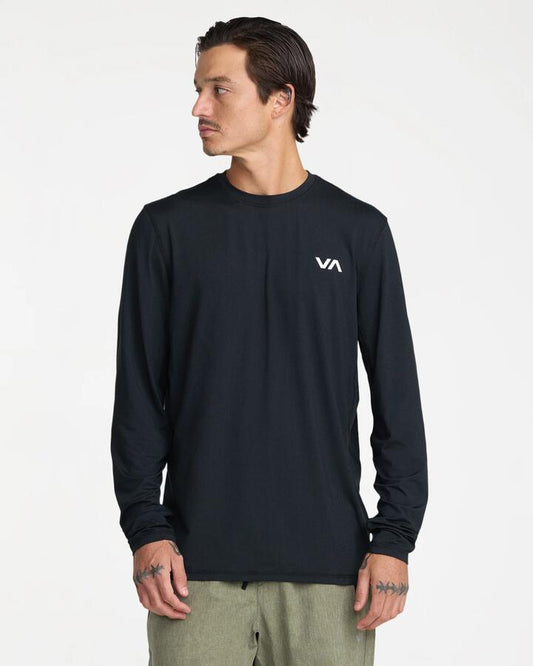 Image of a model wearing Tops. Product name - Rvca Mens Sport Vent Long Sleeve T-Shirt Black in Black colour by brand - Rvca