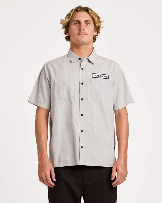 Image of a model wearing Tops. Product name - Volcom Mens Magna Short Sleeve T-Shirt Tower Grey in Tower Grey colour by brand - Volcom